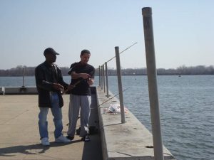 Fishermen convene at Pulaski Park on a sunny March afternoon.