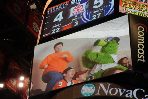 Hill dances with the Phillie Phanatic at a recent Flyers game.