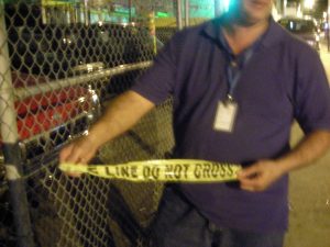Bucceroni on a nightly patrol of the area, showing a piece of police tape where seven people were recently shot.