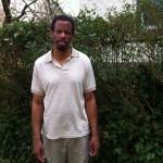 Zimmerman standing next to a tree