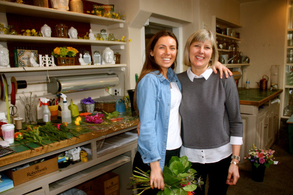 Owner Sandy Robertson (right) works with her daughter Sarah, the fifth generation of Robertson family to work at the florist on Germantown Avenue.