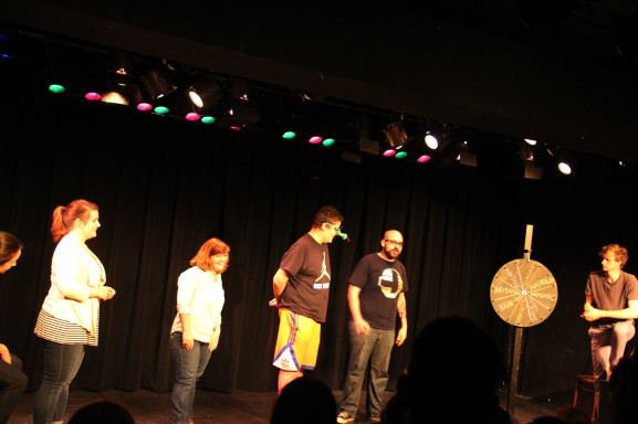 The SHAM!, Philly Improv regulars, determine the content of their skits by the spin of a wheel. 