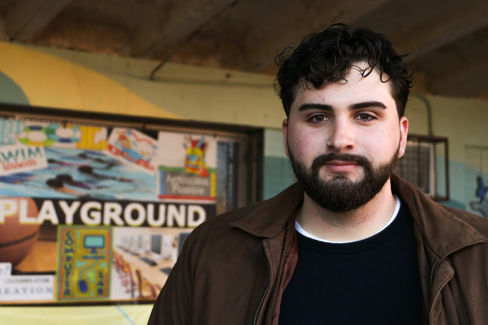 Luca Rizzolo, a 22-year-old Temple University graduate, poses outside the Amos Recreation Center in North Philadelphia before going inside to vote on Tuesday, Nov. 11, 2025. Rizzolo stated that what brought him out to vote was “The three judges… I got all the ads, so…”