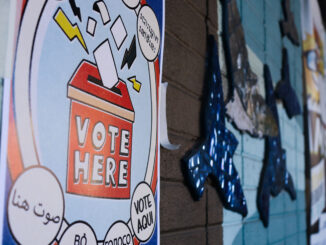 A voting sign is posted on the outside of the Amos Recreation Center in North Philadelphia on Tuesday, Nov. 11, 2025.