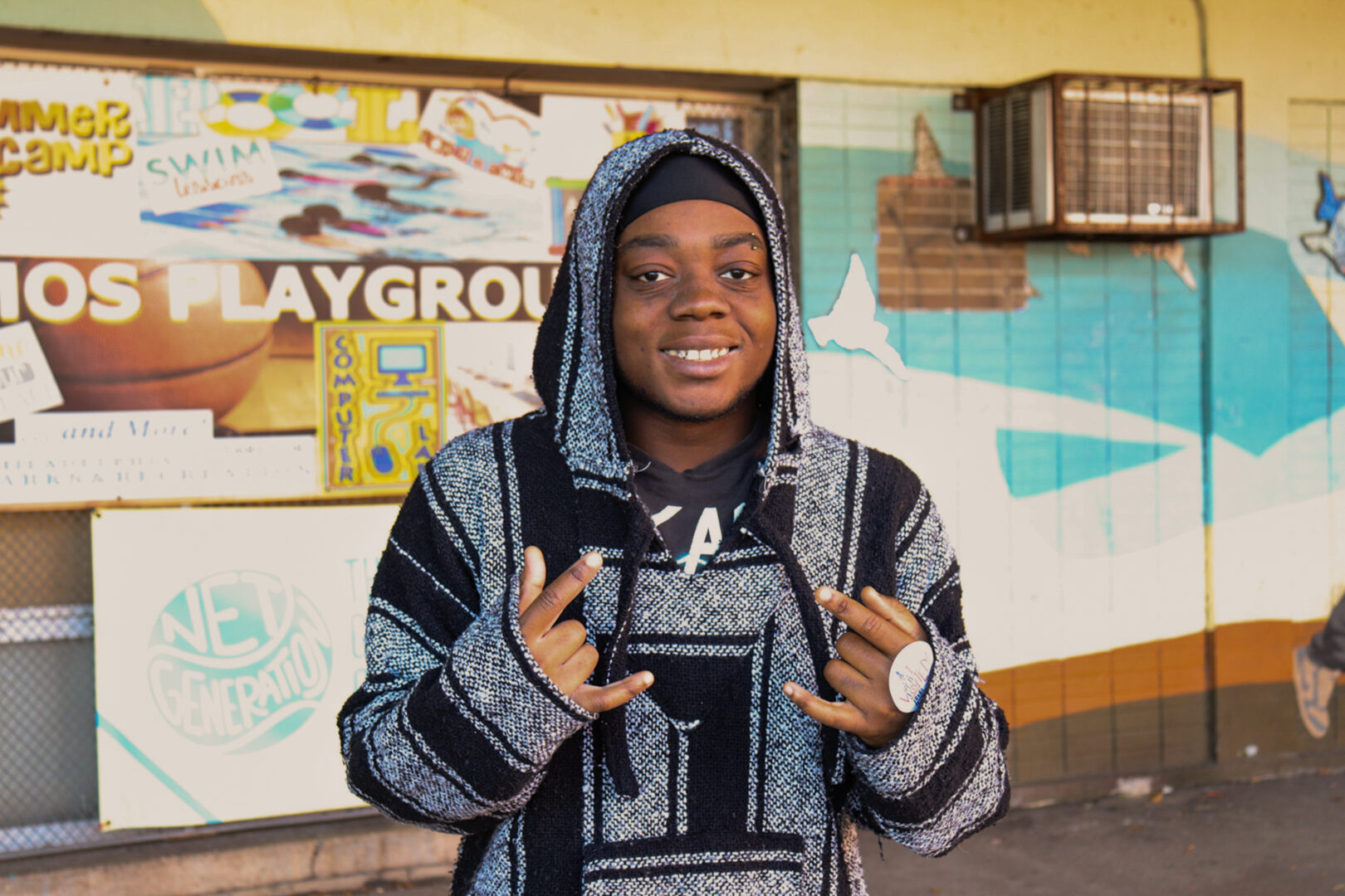 Sae Chea poses with a voting sticker on his hand after voting at the Amos Recreation Center in North Philadelphia on Tuesday, Nov. 11, 2025. Chea stated, “I feel happy.”